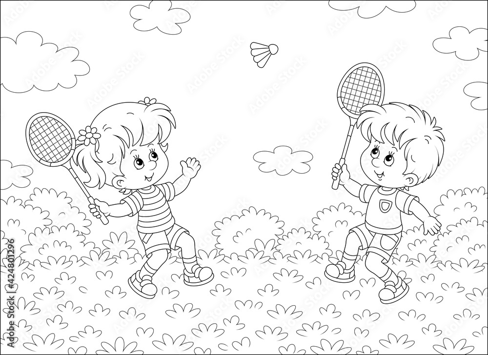 Happy little kids playing badminton with rackets and a flying shuttlecock  in a fun game on